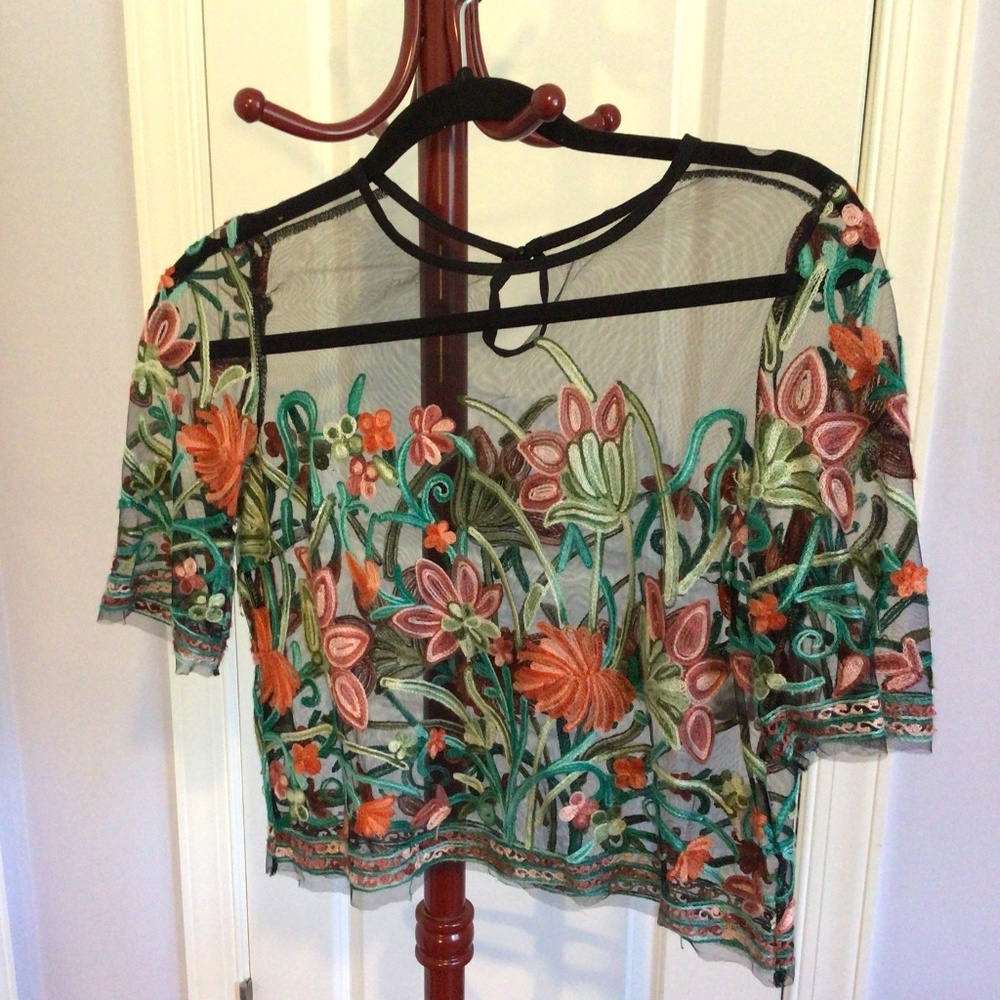 Sheer black crop with floral design. Womens small.